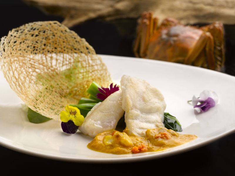 Pan-seared Graoupa Fillet with Vegetable topped with Hairy Crab Roe